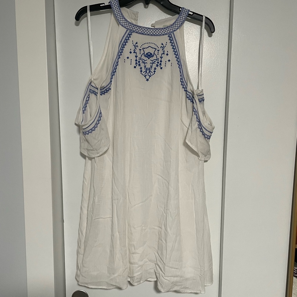 White off the shoulder flowy dress with blue embroidered details